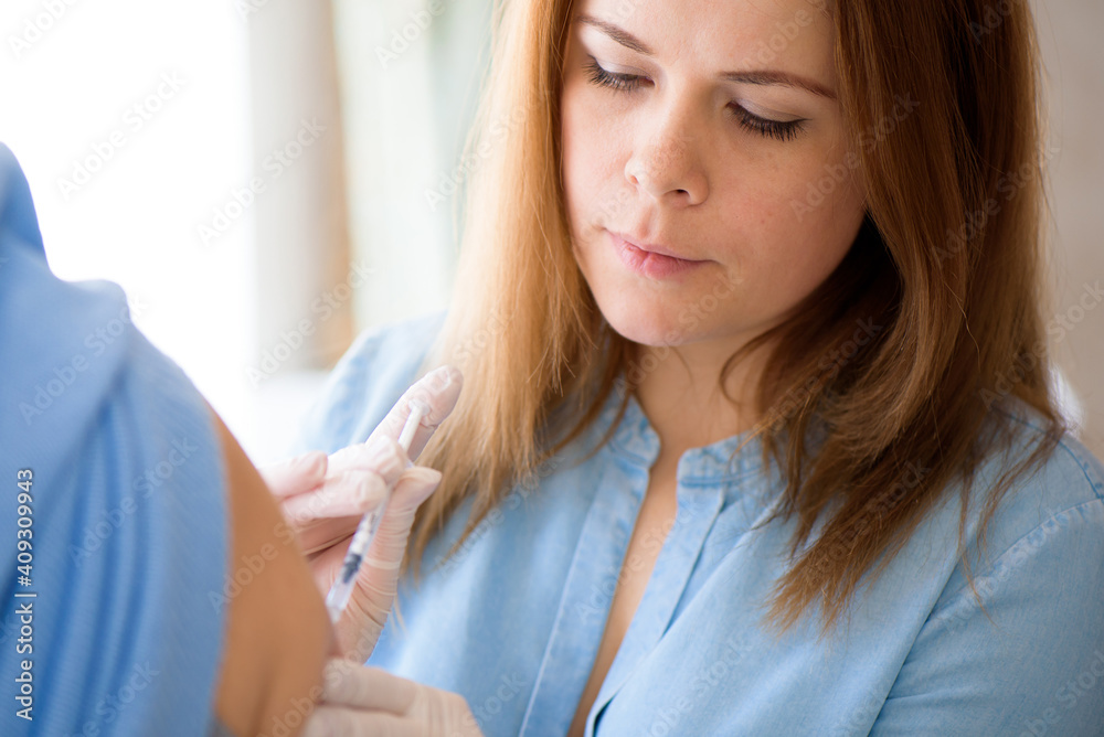 Coronavirus vaccine. A doctor makes a coronavirus vaccine at a hospital. Coronavirus vaccine. A doctor makes a coronavirus vaccine at a hospital.