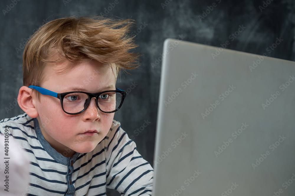 Online lesson for kids. Self isolation on covid 19 lock down. Tablet for homework, Child using laptop computer for IT on internet. Home schooling, Social Distance, E-learning online education Online lesson for kids. Self isolation on covid 19 lock down. Tablet for homework, Child using laptop computer for IT on internet. Home schooling, Social Distance, E-learning online education