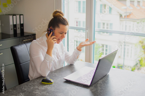 Angry accountant in front of the computer