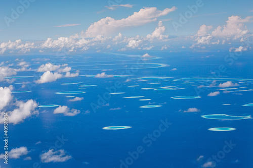Window view from airplane on maldivian atoll with islands © photopixel