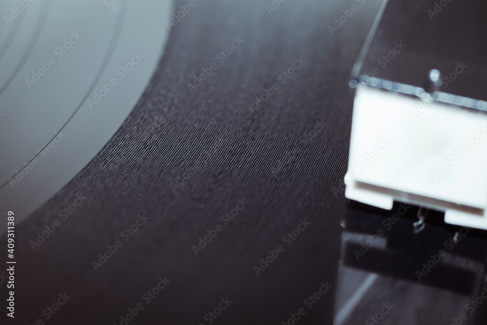 Cinemagraph vinyl record spinning. Wide shot close up of needle playing record album on a vintage turntable. Old school record player .retro record vinyl player Cinemagraph vinyl record spinning. Wide shot close up of needle playing record album on a vintage turntable. Old school record player .retro record vinyl player