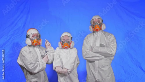 The family shield protect, to save life from virus. Slow motion. People portrait, wearing protect medical aerosol spray paint mask respirator. Concept health safety protection coronavirus epidemic. photo