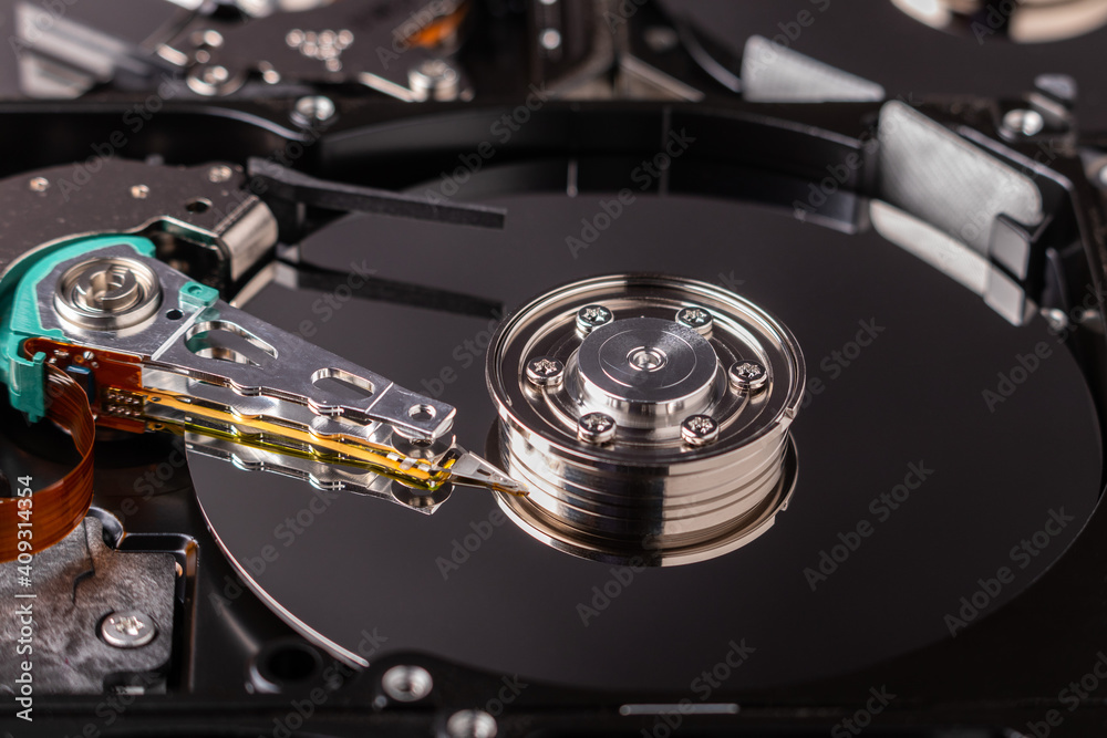 close up of an open hard disk drive close up of an open hard disk drive