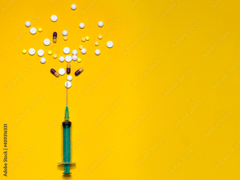 Vaccination against the Covid19 virus. Syringe. Yellow, white tablets, pills. Treatment. Yellow background with a free window for an inscription. Vaccination against the Covid19 virus. Syringe. Yellow, white tablets, pills. Treatment. Yellow background with a free window for an inscription.
