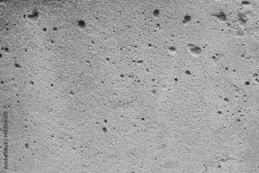 Abstract background from a gray concrete surface with notches Abstract background from a gray concrete surface with notches