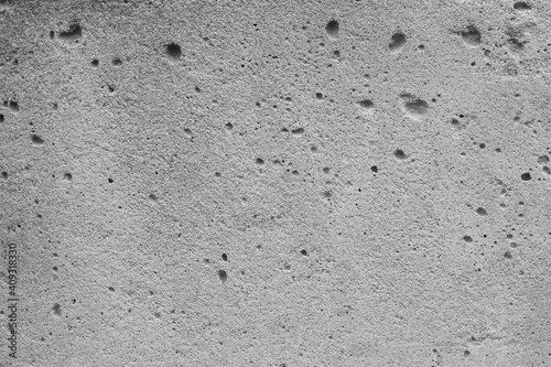Abstract background from a gray concrete surface with notches