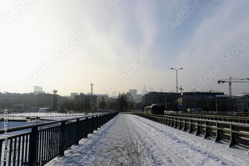 Winter cityscape, view from  the cycling and pedestrian path on Swietokrzyski Bridge to city center. Cold winter day at Warsaw, Poland © PaulSat