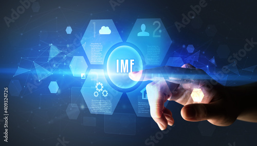 Hand touching IMF inscription, new technology concept