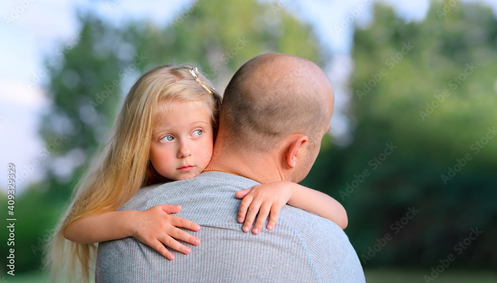 Little blonde sad daughter hugging his dad Little blonde sad daughter hugging his dad