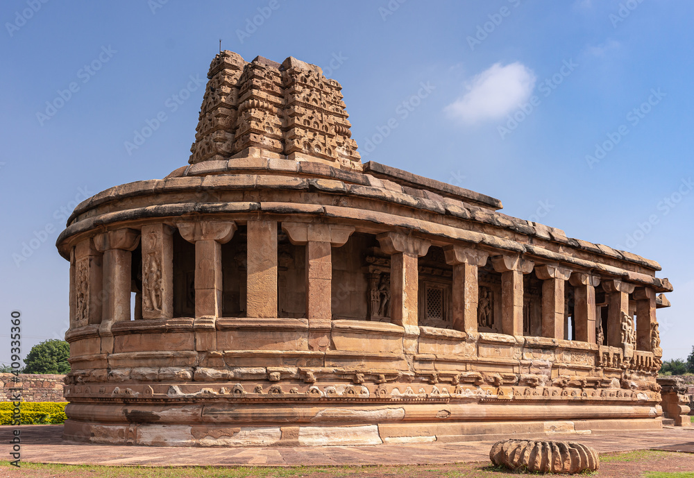 Aihole, Karnataka, India - November 7, 2013: Durga Gudi or Temple under blue cloudscape, the entire building with lost top of Vimanam.