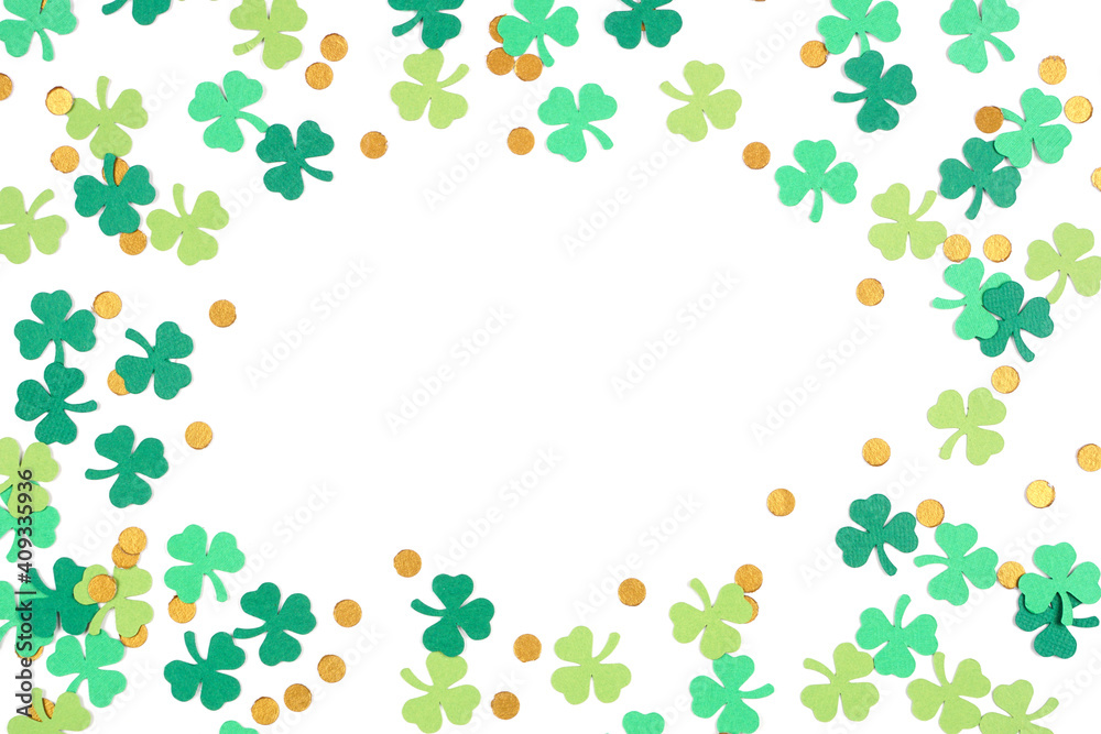 St Patricks Day shamrock and gold coin confetti frame isolated on a white background with copy space St Patricks Day shamrock and gold coin confetti frame isolated on a white background with copy space