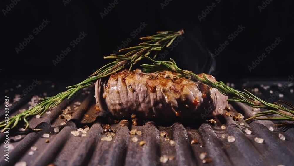 Delicious juicy meat steak cooking on grill. Aged prime rare roast