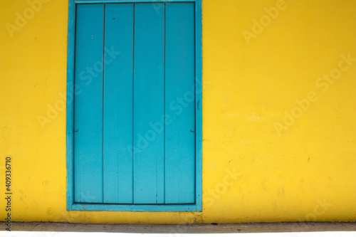 blue door and yellow wall