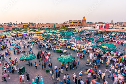 MARRAKECH, MOROCCO, SEPTEMBER 3 2018: Djemaa El Fna market square from above at sunset photo