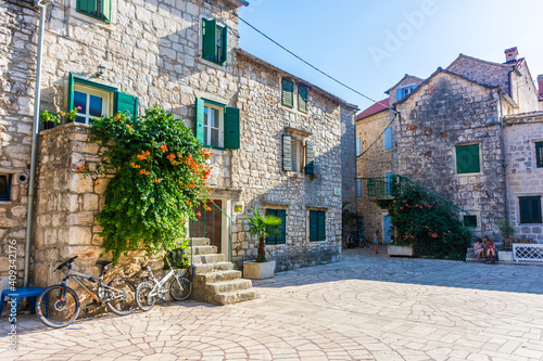 STARI GRAD, CROATIA, AUGUST 7 2019: Children playing in a little square of the historic center