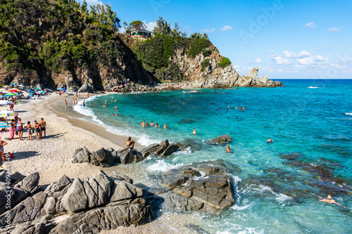 The beautiful Zambrone beach full of tourists an bathers during summertime, Calabria, Italy
