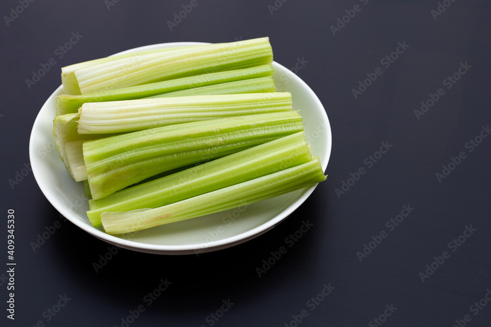 Fresh celery on dark background. Fresh celery on dark background.