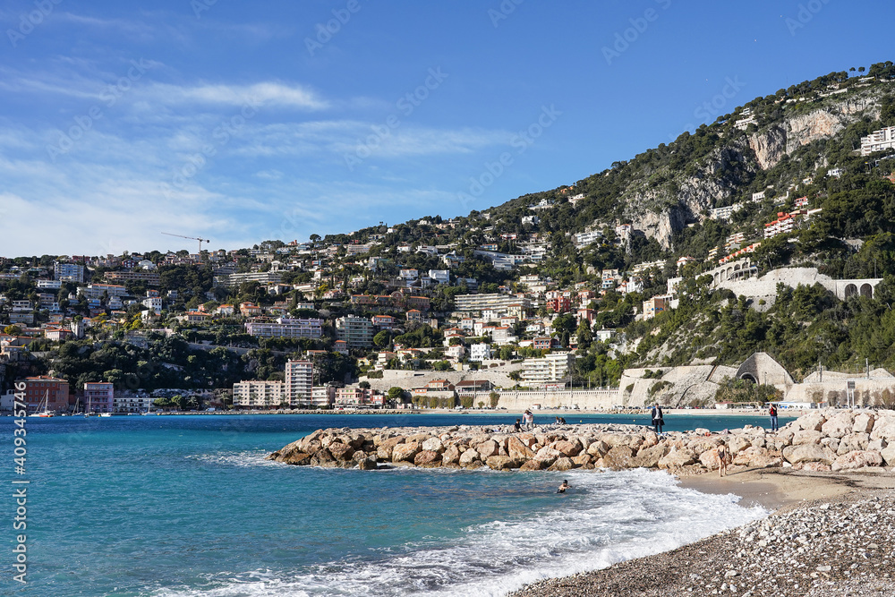 Nice view of the coastline and hills of the bay of Villefranche-sur-Mer on the Mediterranean Sea. French Riviera. 