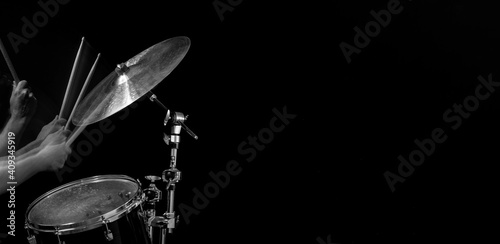 Foto Stroboscopic drummer hitting cymbals with drum sticks