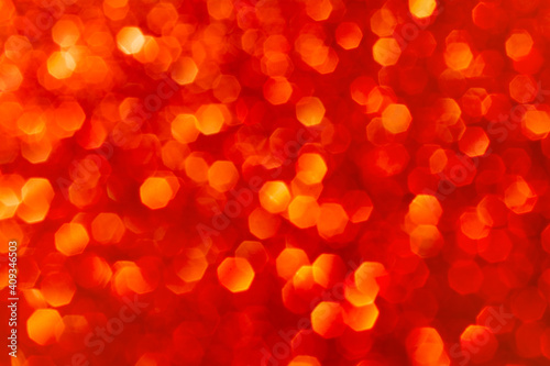 Abstract red and gold glitter lights background. Circle blurred bokeh. Romantic backdrop for Christmas, Valentines day, womens day, holiday or event
