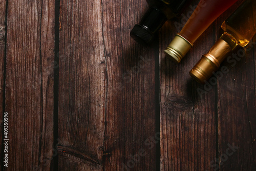 Cooking oil on top of wooden table for background.