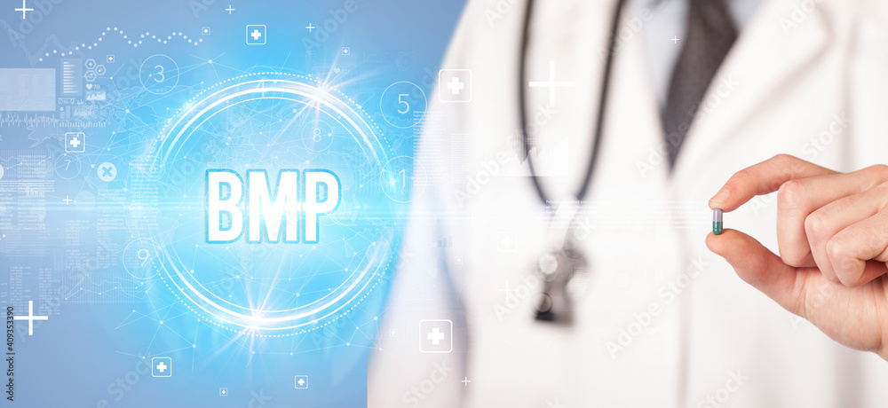 Close-up of a doctor giving you a pill with BMP abbreviation, virology concept Close-up of a doctor giving you a pill with BMP abbreviation, virology concept