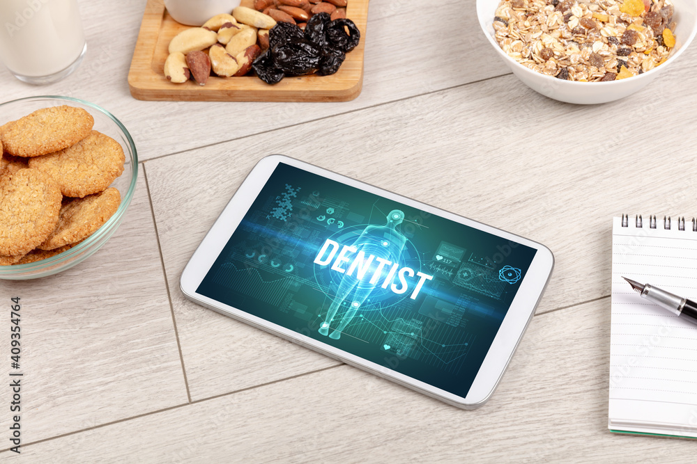 DENTIST concept in tablet with fruits, top view DENTIST concept in tablet with fruits, top view