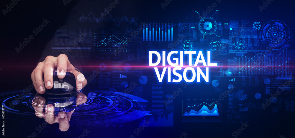 hand holding wireless peripheral with DIGITAL VISON inscription, modern technology concept hand holding wireless peripheral with DIGITAL VISON inscription, modern technology concept
