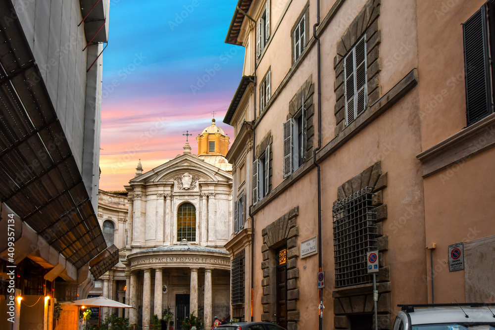A typical Roman street in the Ponte District of Rome, Italy, leads to the Santa Maria della Pace, a small church near the Piazza Navona in Rome Italy.