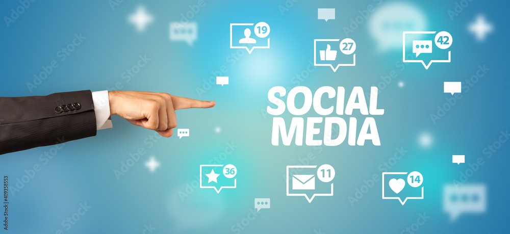Close-Up of cropped hand pointing at SOCIAL MEDIA inscription, social networking concept Close-Up of cropped hand pointing at SOCIAL MEDIA inscription, social networking concept