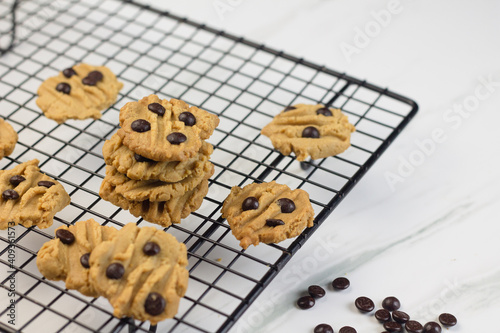 Homemade chocolate chips cookies on marble white background. 