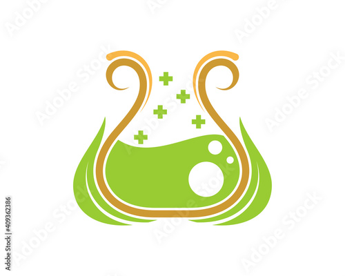 Nature leaf and green liquid in the laboratory test tube
