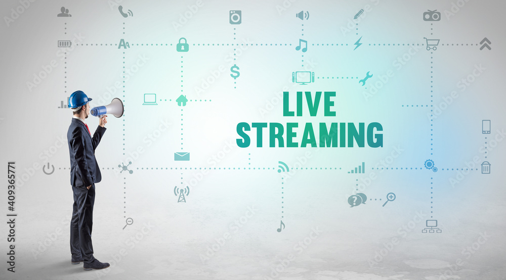 Engineer working on a new social media platform with LIVE STREAMING inscription concept Engineer working on a new social media platform with LIVE STREAMING inscription concept