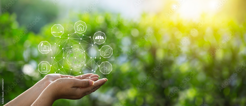 Technology, hand holding with environment Icons over the Network connection on green background. Technology, hand holding with environment Icons over the Network connection on green background.