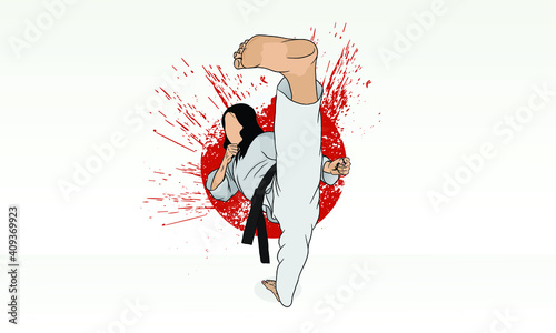 A karate girl practicing the martial art of karate does a stretch.
