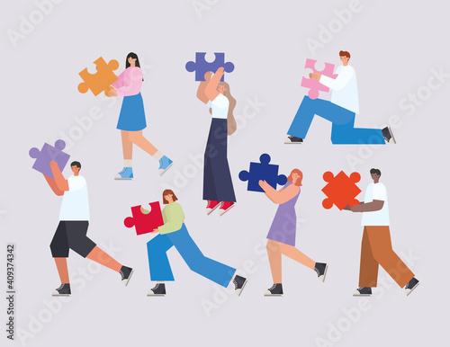 group of people with puzzle pieces on a gray background