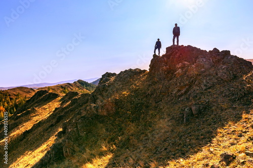 mature tourists you are on a walk along the Nurali ridge in the Ural mountains. Uchalinsky district. Bashkortostan. photo