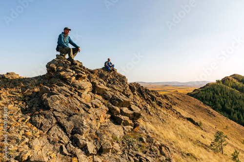 mature tourists you are on a walk along the Nurali ridge in the Ural mountains. Uchalinsky district. Bashkortostan. photo