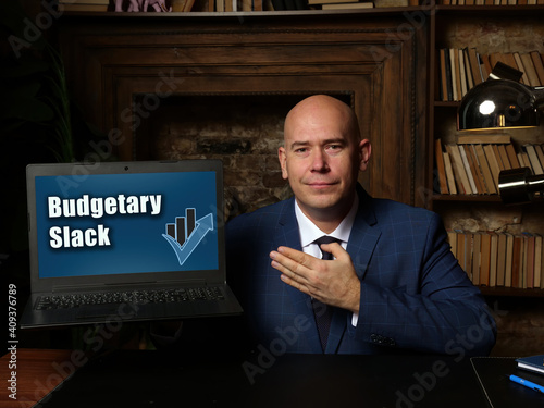 Business concept meaning Budgetary Slack with sign on laptop.