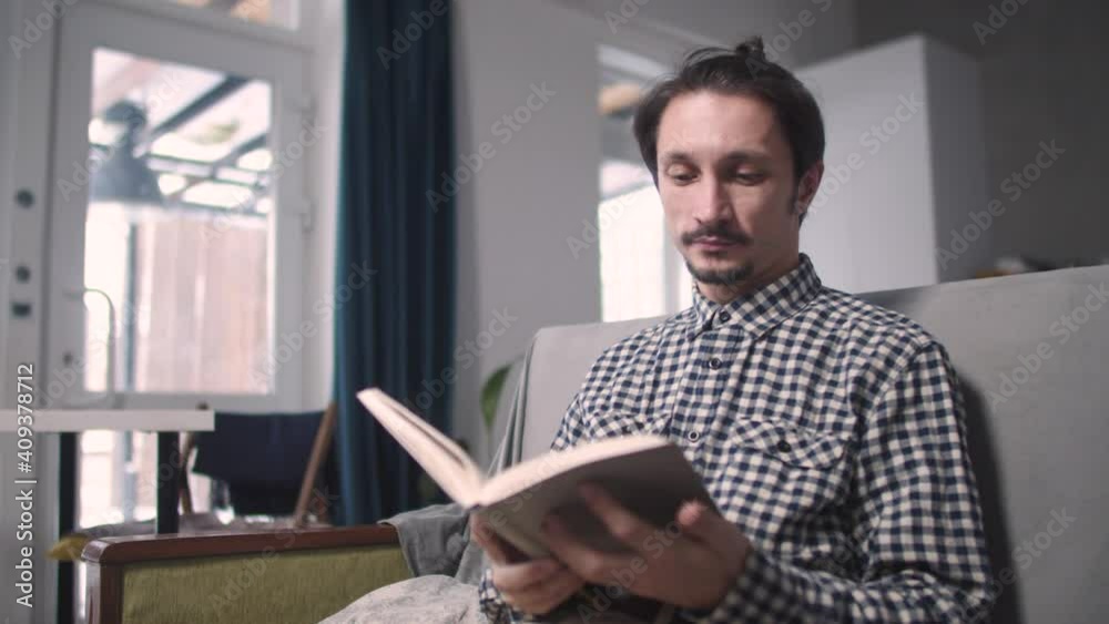 the guy reads the book thoughtfully the guy reads the book thoughtfully
