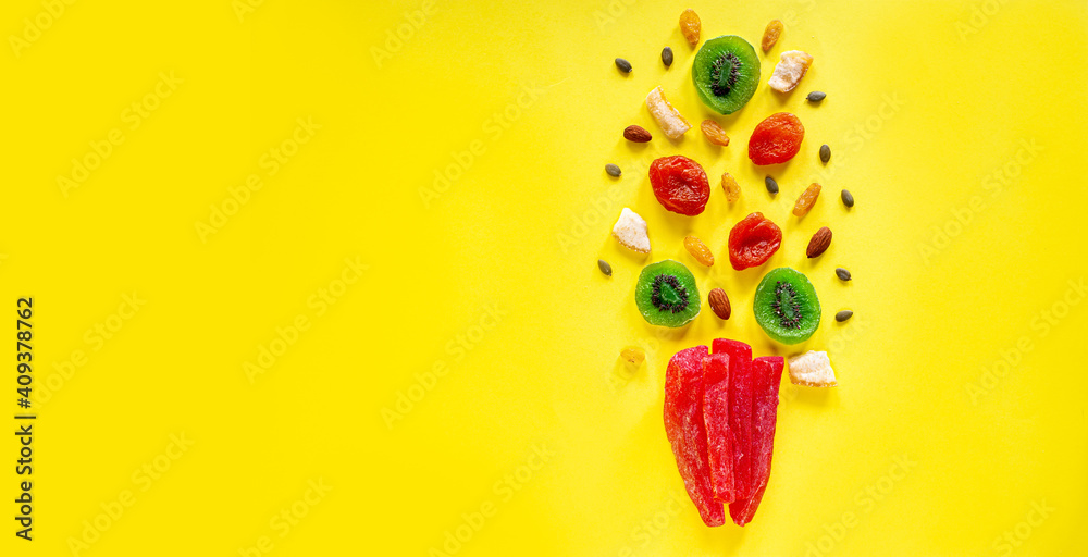 Composition of multicolored candied fruit on a yellow background. View from above. A place for text. Organic Vegan Sweets Composition of multicolored candied fruit on a yellow background. View from above. A place for text. Organic Vegan Sweets