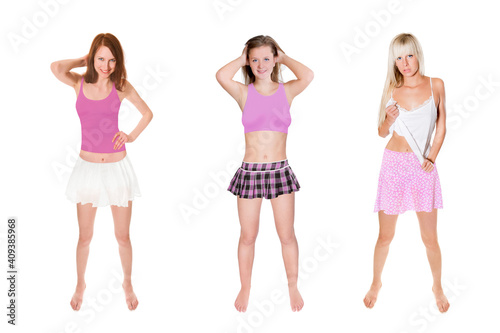 Three attractive young women wearing pink and white summer clothes in front of white studio background