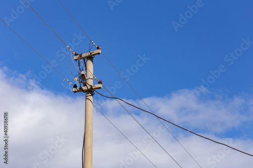 Old electricity pole and blue sky in Turkey.