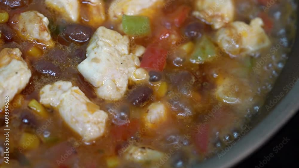 Cooking chili con carne with chicken. Close-up