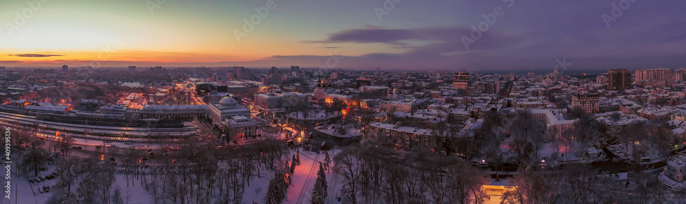 Air panorama Odessa Ukraine with Main train station and urbane winter landscape. Drone footage, evening ..