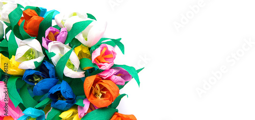 artificial tulip flower texture, upper view, colored paper fake flowers background. Copyspace