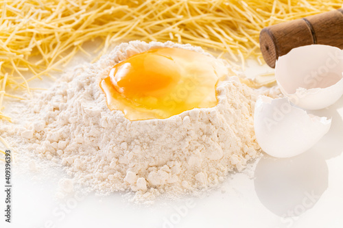 broken egg in flour and pasta