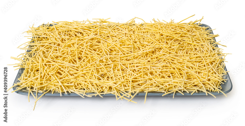 raw pasta noodles on white isolated background raw pasta noodles on white isolated background