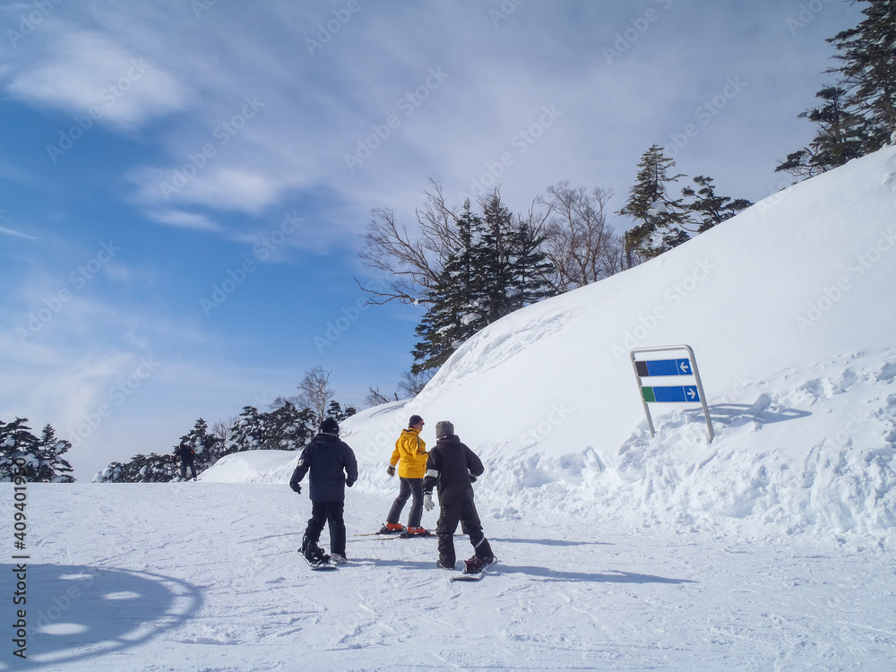 Snowboarders in a sunny ski resort (Kawaba, Gunma, Japan)