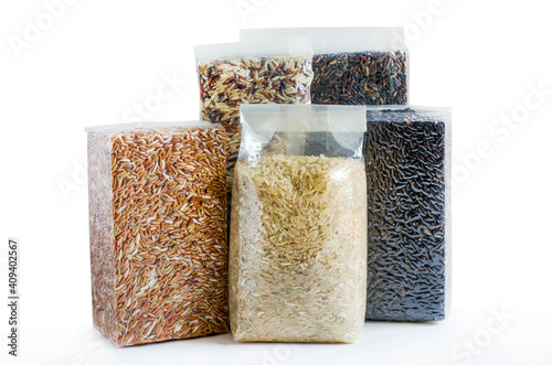 Group of organic rice seeds in plastic or vacuum package on white background